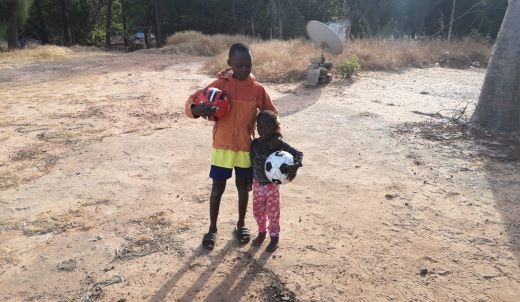 Donating footballs during Gambia asbestos removal project